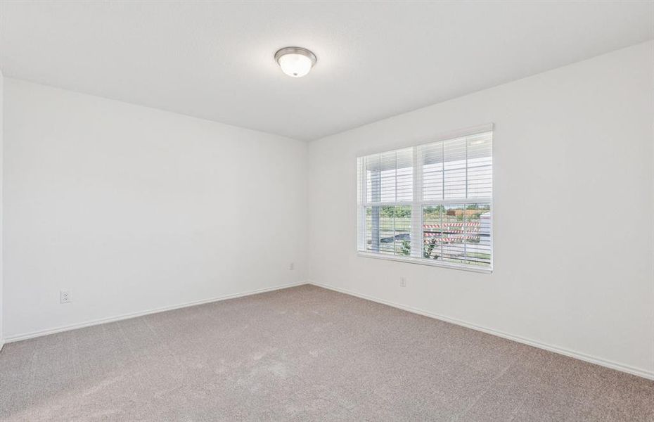 Spacious secondary bedroom with large windows Spacious secondary bedroom with large windows