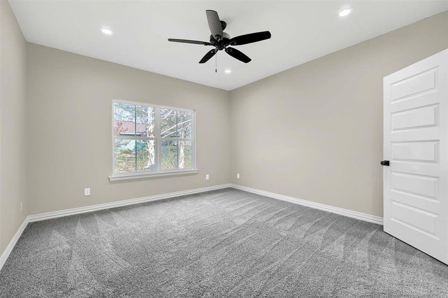 Unfurnished room with carpet flooring and ceiling fan