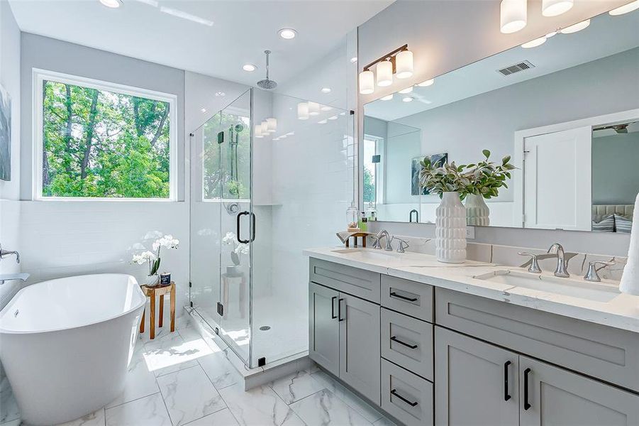 Spa like bathroom with rain and hand held shower fixtures!