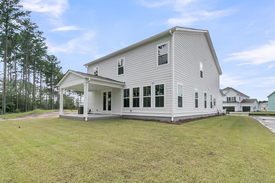 Exterior details and patio area of a home in Tidewater at Lakes of Cane Bay, Summerville (Image 27).