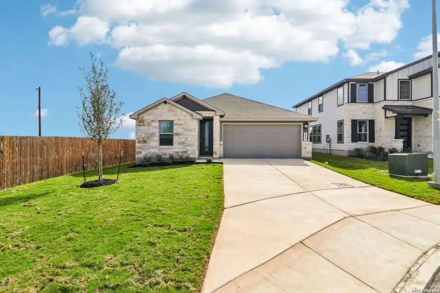 Front exterior of a new home in Catalina, Converse, TX, highlighting curb appeal (Image 2). Front exterior of a new home in Catalina, Converse, TX, highlighting curb appeal (Image 2).