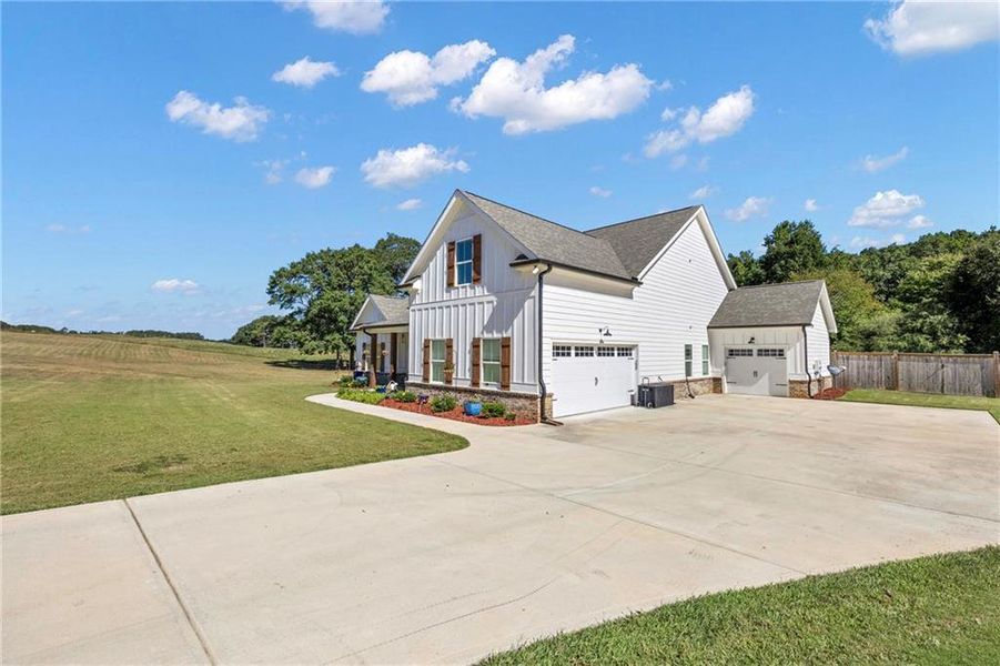 Front exterior of a new home in , Monroe, GA, highlighting curb appeal (Image 23). Front exterior of a new home in , Monroe, GA, highlighting curb appeal (Image 23).
