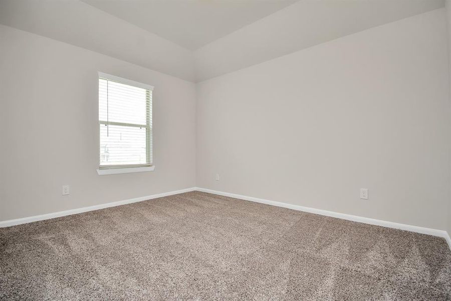 This expansive fourth bedroom features large window that floods the room with natural light. **This image is from another Saratoga Home with similar floor plan and finishes, not the Brittany floorplan.**