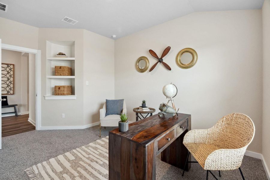 4th bedroom or office space featuring built in bookshelves & a walk-in closet 4th bedroom or office space featuring built in bookshelves & a walk-in closet