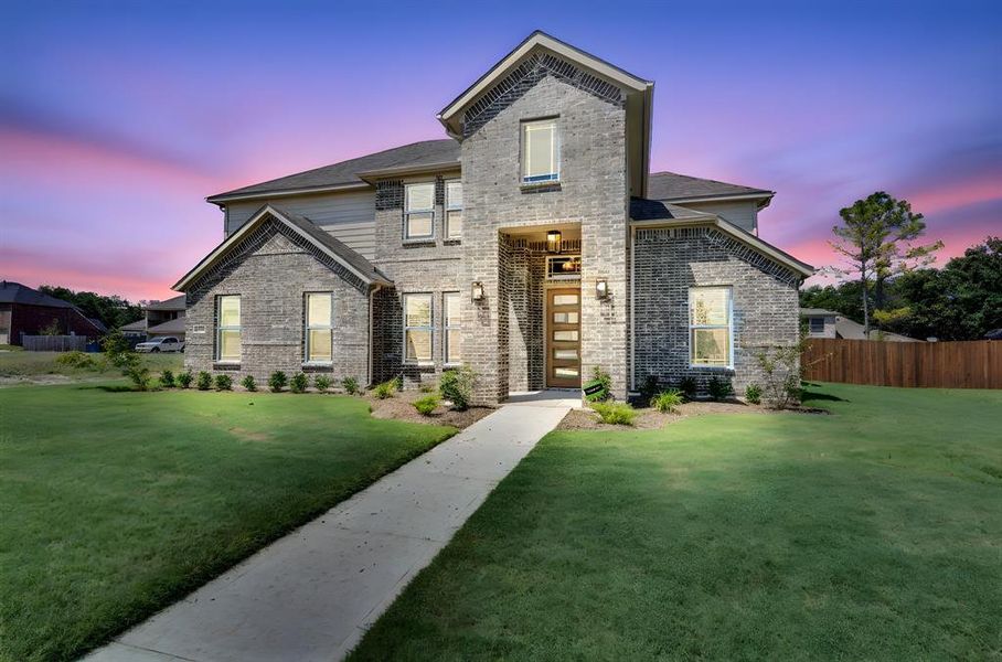 Front exterior of a new home in Ten Mile Creek Estates, DeSoto, TX, highlighting curb appeal (Image 20). Front exterior of a new home in Ten Mile Creek Estates, DeSoto, TX, highlighting curb appeal (Image 20).