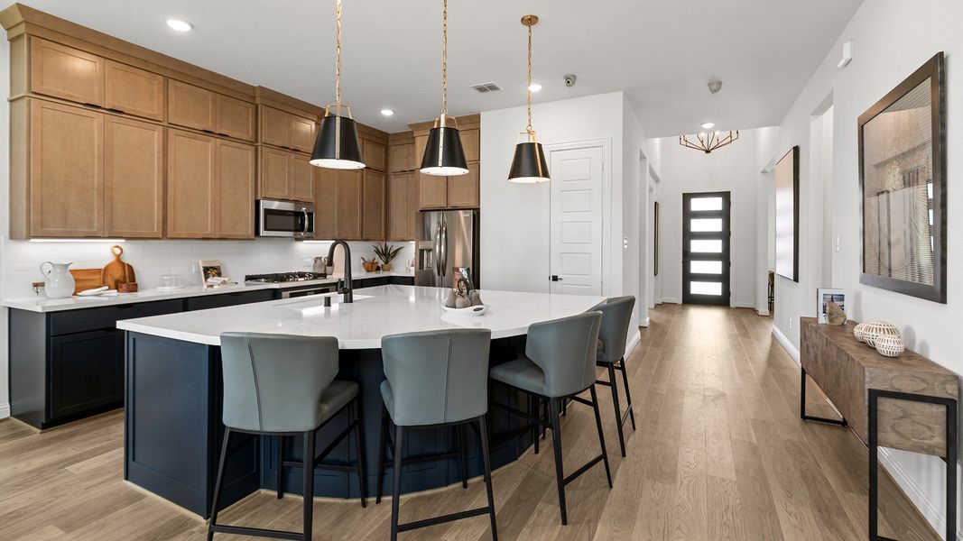 Representative furnished interior of a home built from the Magnolia by Brightland Homes in Sunterra, Katy (Image 6).