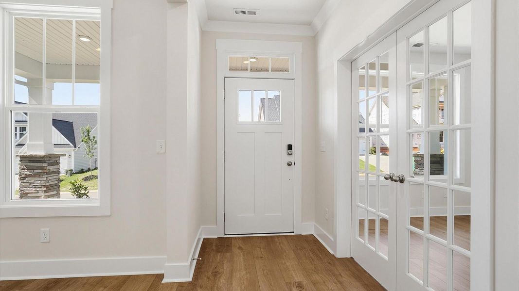 Highly functional foyer with hardwood flooring that flows seamlessly into living spaces at the Benjamin's Grove community Highly functional foyer with hardwood flooring that flows seamlessly into living spaces at the Benjamin's Grove community