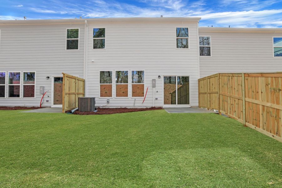 Exterior details and patio area of a home in Villas at Dawsonville Townhomes, Dawsonville (Image 24).