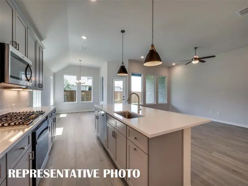 The chef will never be left out of the party in this wonderful open concept design.  REPRESENTATIVE PHOTO