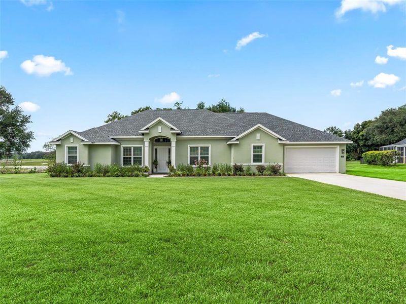Front exterior of a new home in , Lady Lake, FL, highlighting curb appeal (Image 22). Front exterior of a new home in , Lady Lake, FL, highlighting curb appeal (Image 22).