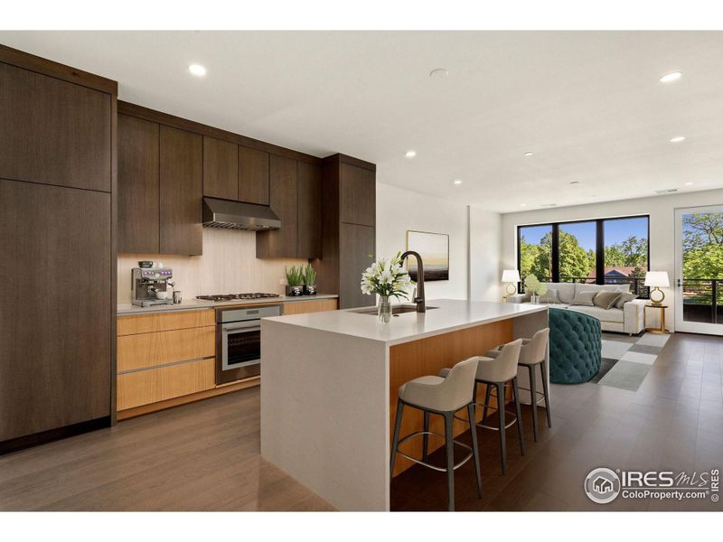 Rich, custom color cabinetry from Genesis Innovations and a waterfall island welcomes you into this beautiful space (this photo is virtually staged).