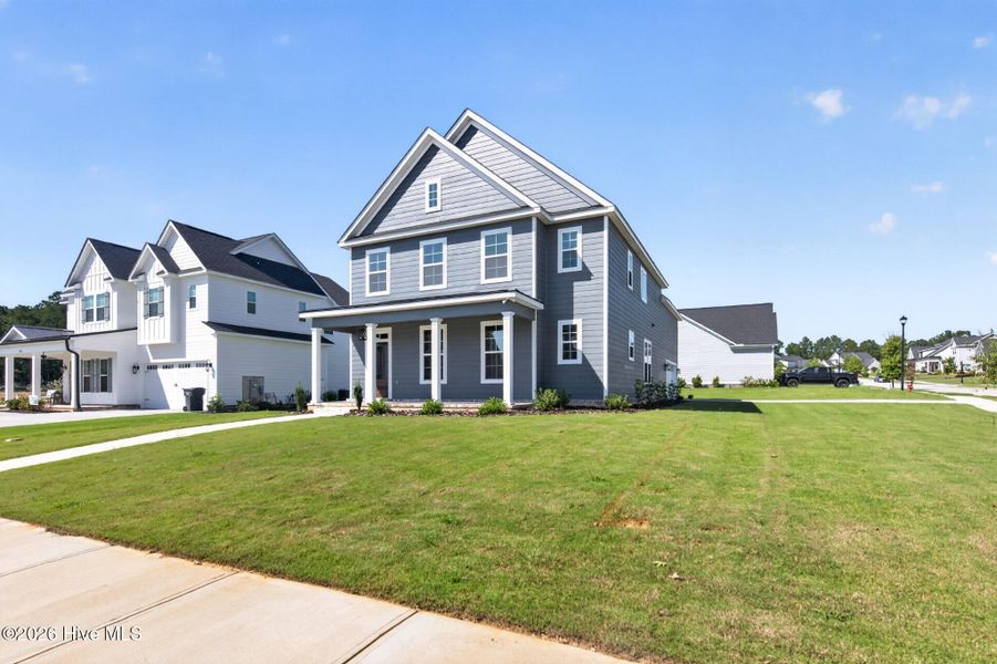 Front exterior of a new home in Highland Lakes, Evans, GA, highlighting curb appeal (Image 20). Front exterior of a new home in Highland Lakes, Evans, GA, highlighting curb appeal (Image 20).