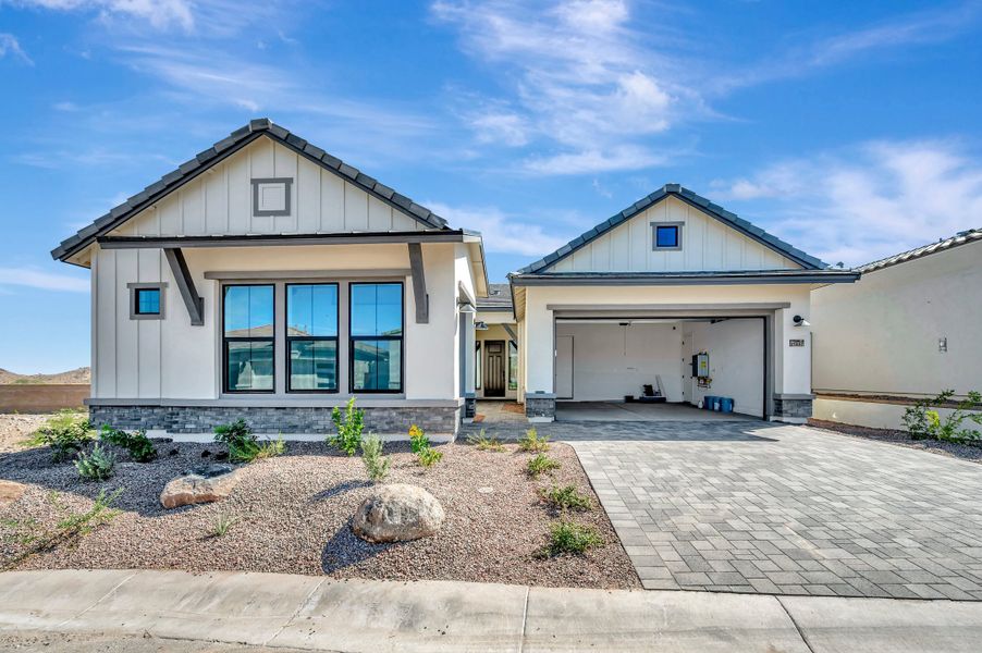 Front exterior of a new home in Skyline at Verrado Regent Hills, Buckeye, AZ, highlighting curb appeal (Image 2). Front exterior of a new home in Skyline at Verrado Regent Hills, Buckeye, AZ, highlighting curb appeal (Image 2).