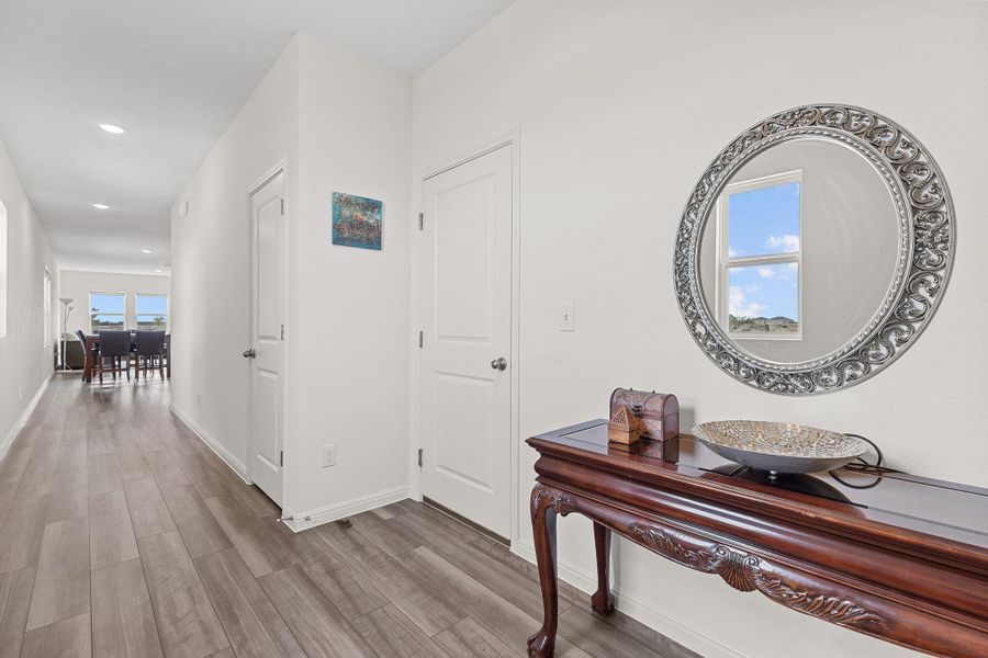 Hall with wood finished floors and recessed lighting Hall with wood finished floors and recessed lighting