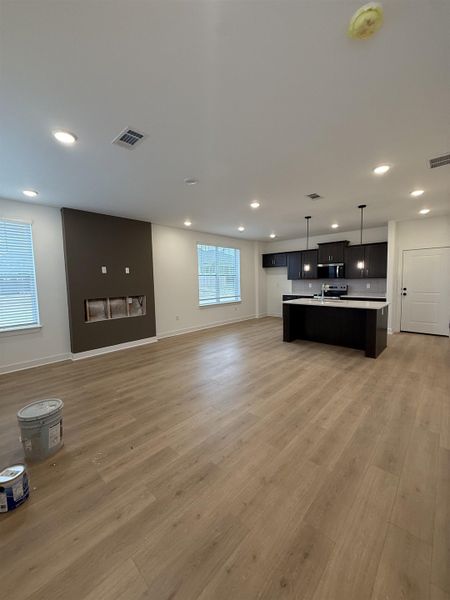 Unfurnished living room with light wood-style floors and recessed lighting