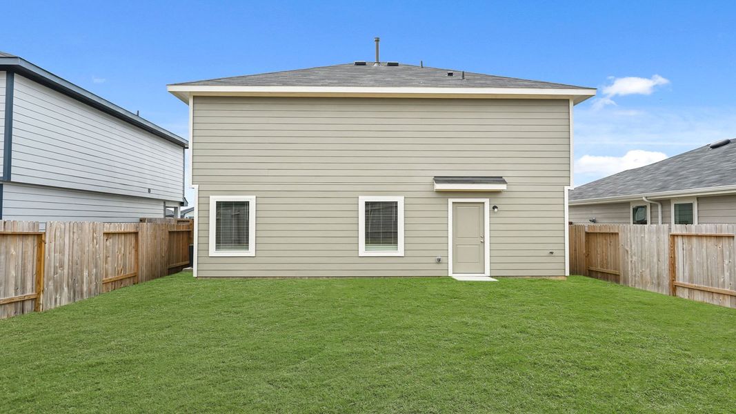 Exterior details and patio area of a home in The Canopies, Splendora (Image 16).