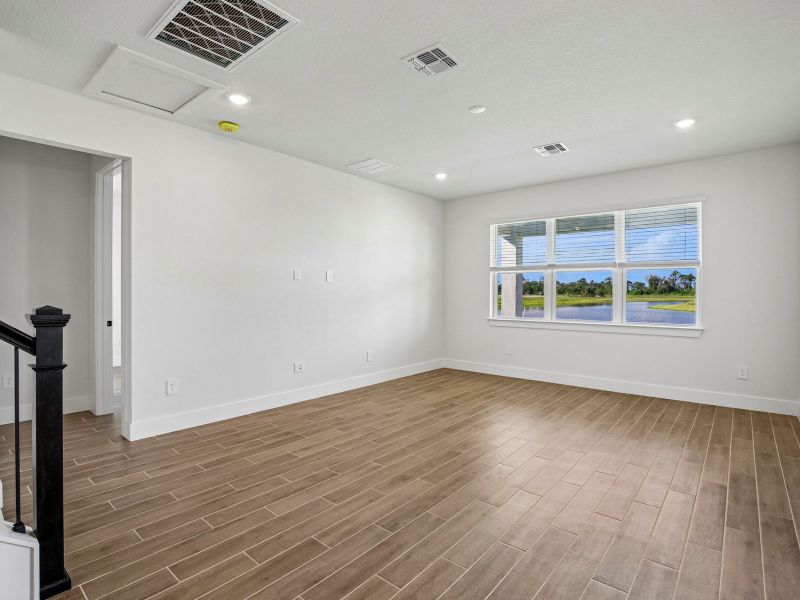 Spacious, unfurnished interior of a new home in Magnolia Bay - Reserve Series, Nokomis (Image 14).