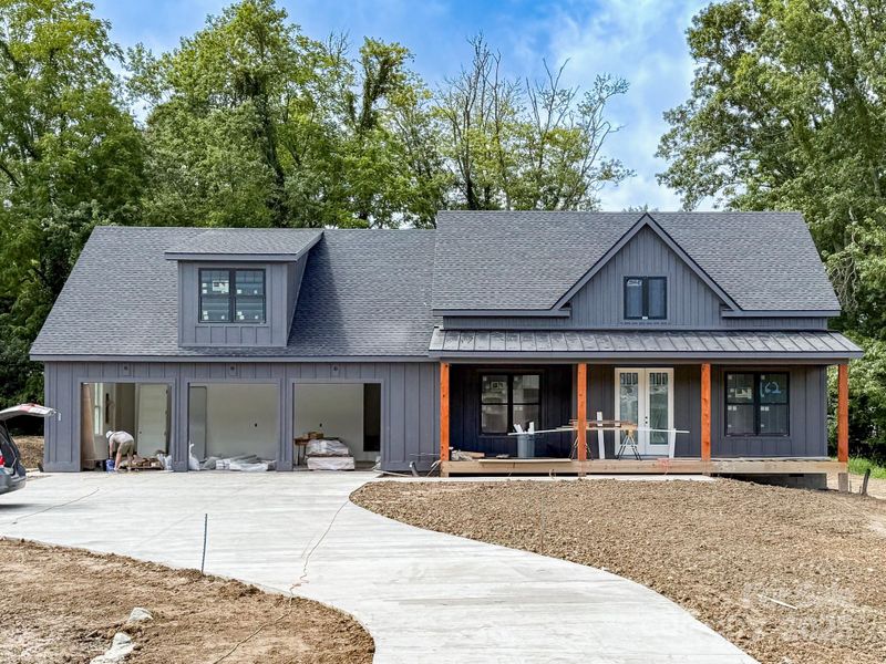 Front exterior of a new home in , Mills River, NC, highlighting curb appeal (Image 22).