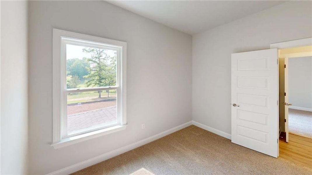 Spacious, unfurnished interior of a new home in Mirror Lake at South Harbour, Villa Rica (Image 15).