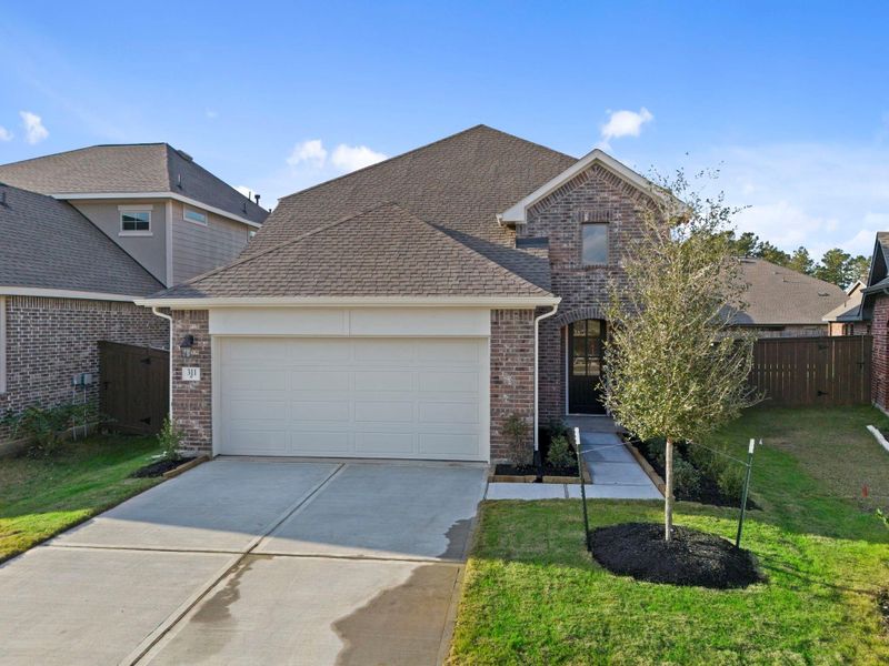 Front exterior of a new home in The Trails 40', New Caney, TX, highlighting curb appeal (Image 21).