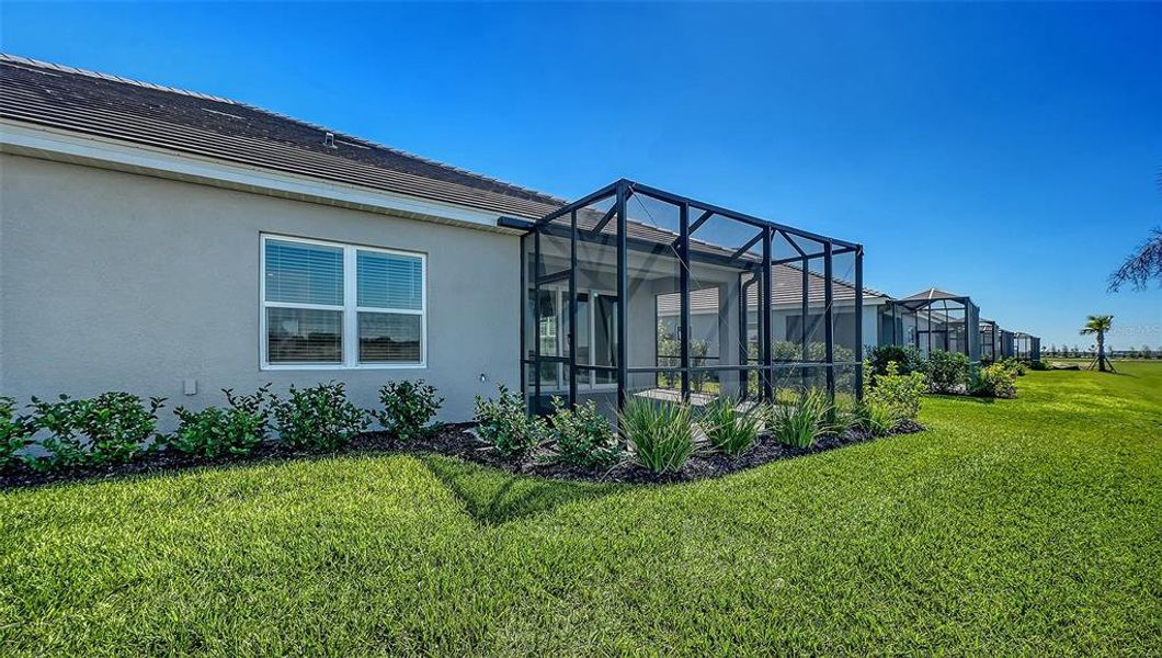 Exterior details and patio area of a home in Palm Grove, Lakewood Ranch (Image 26).