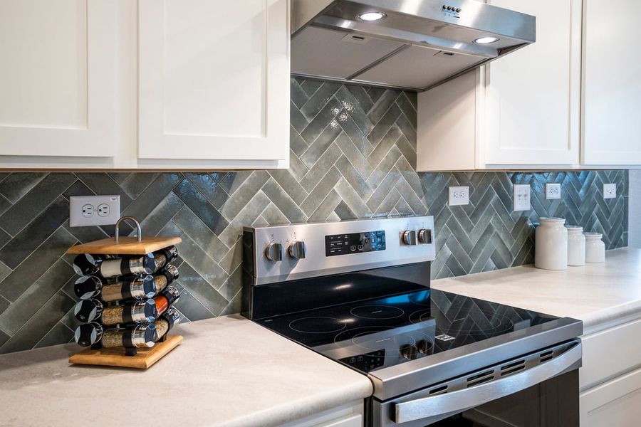 Optional herringbone pattern tile backsplash