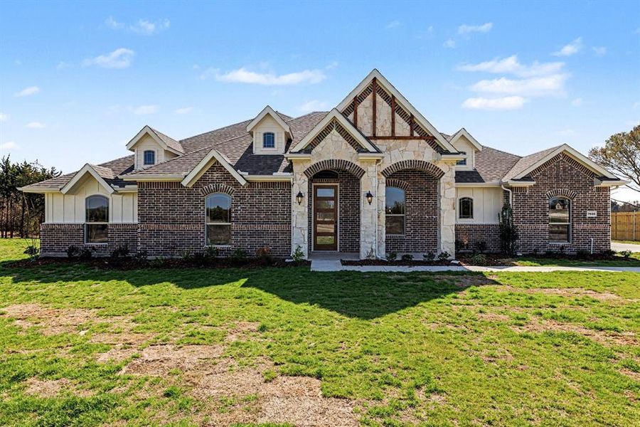 Front exterior of a new home in Sagebrush Addition, Midlothian, TX, highlighting curb appeal (Image 20).