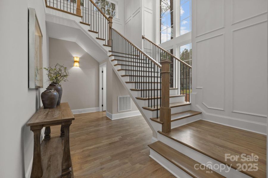 Foyer with grand floating staircase