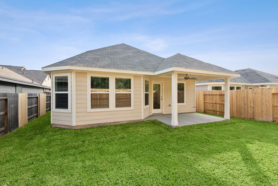Exterior details and patio area of a home in Pinewood at Grand Texas, New Caney (Image 1). Exterior details and patio area of a home in Pinewood at Grand Texas, New Caney (Image 1).