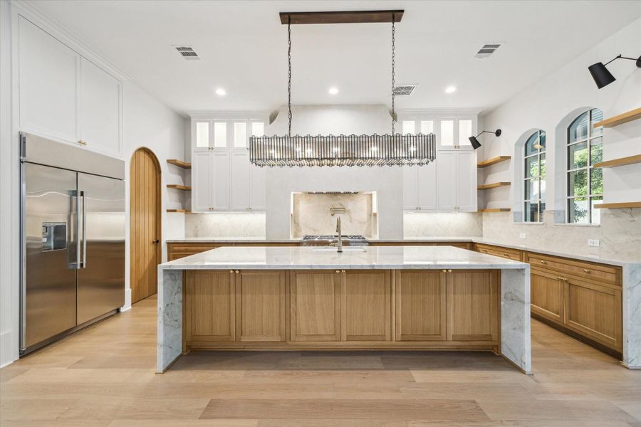 Gourmet kitchen is a chef's dream!*Picture is of a recently constructed home by the builder.  1519 Candlelight will be similar in quality, but these pictures are not meant to be an exact representation of the new home. Specs of home may change at sole discretion of the seller.