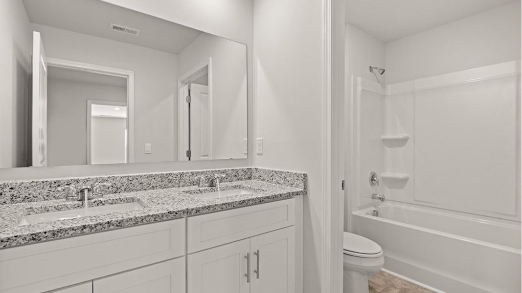 Representative furnished interior of a home built from the Mansfield by D.R. Horton in Highland Hills, Graniteville (Image 11).