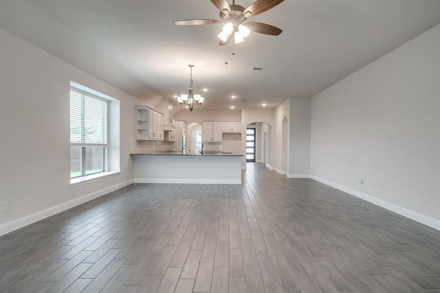 Living room open to breakfast area and kitchen