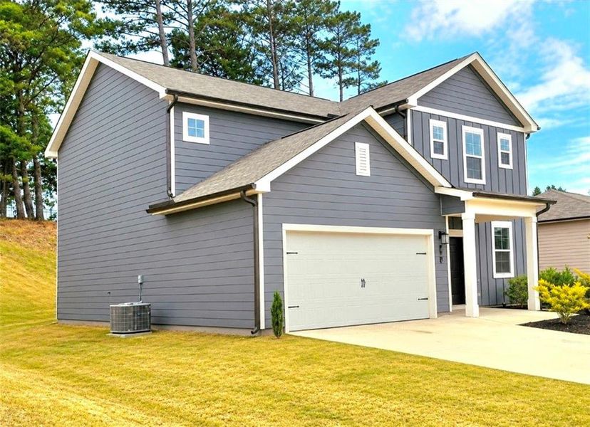 Front exterior of a new home in Alcovy Trace, Lawrenceville, GA, highlighting curb appeal (Image 15).