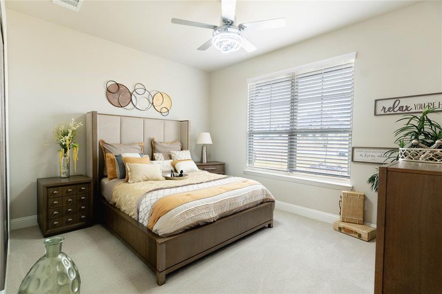 Bedroom featuring carpet and a ceiling fan