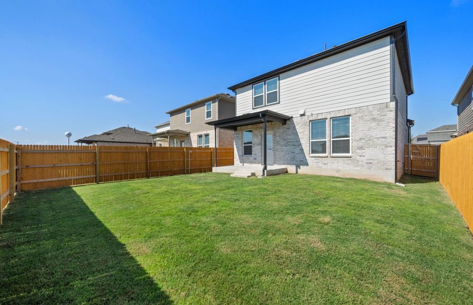 Exterior details and patio area of a home in Crosswinds, Kyle (Image 4).