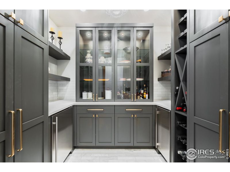 Beautiful butler's pantry with wine storage.