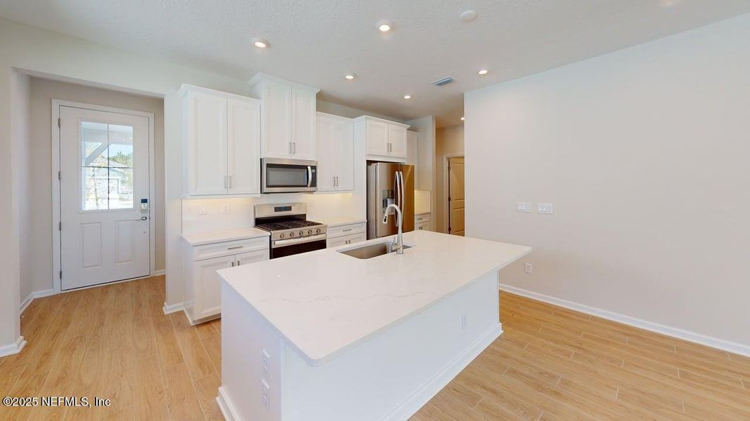 Furnished interior view inside a new home in RiverTown - WaterSong, St. Johns (Image 10).