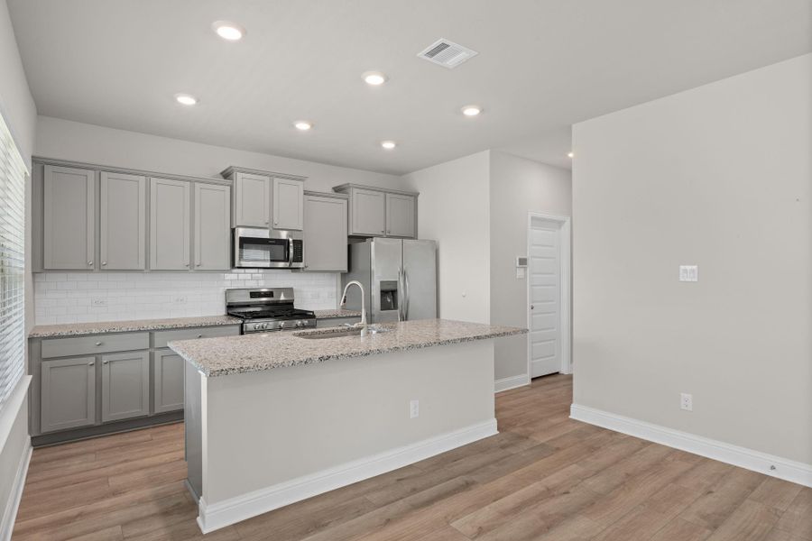 Furnished interior view inside a new home in Sunterra, Katy (Image 5).