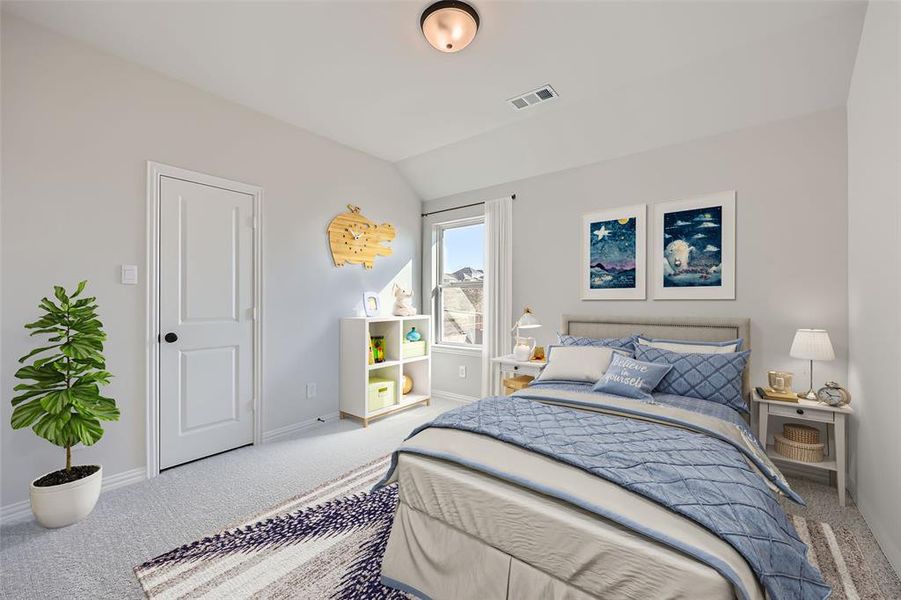 VIRTUALLY STAGED PHOTO - Carpeted bedroom featuring lofted ceiling