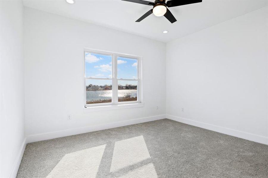 Carpeted spare room featuring recessed lighting, baseboards, and ceiling fan Carpeted spare room featuring recessed lighting, baseboards, and ceiling fan