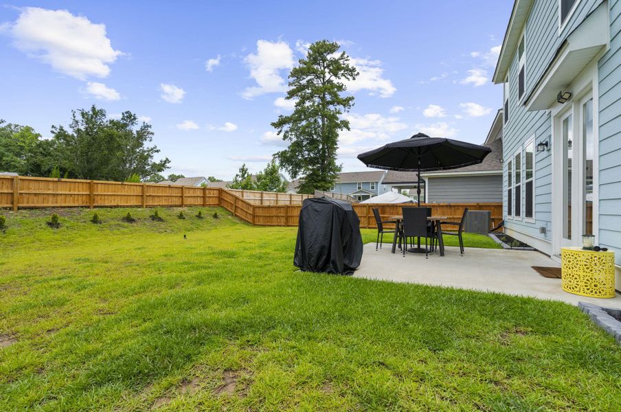 Exterior details and patio area of a home in High Point at Foxbank, Moncks Corner (Image 26).