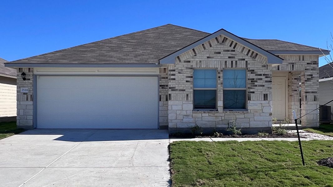 Front exterior of a new home in Pecan Creek, Temple, TX, highlighting curb appeal (Image 1).