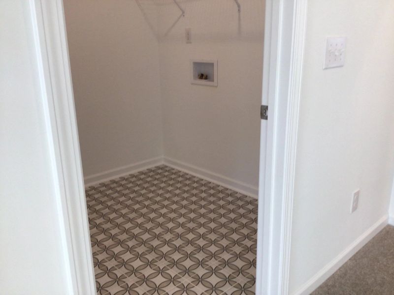 Laundry Room featuring the AW Collection® Coastal - Bright space with wire shelving for ease.