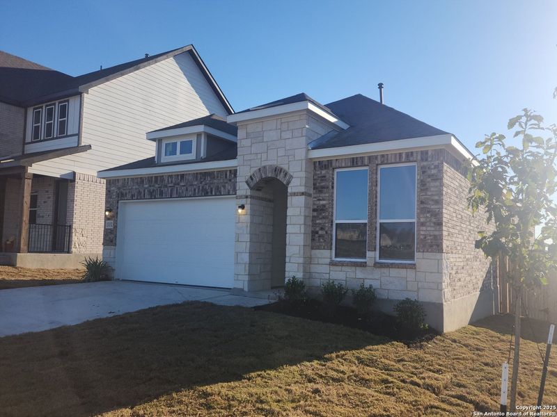 Front exterior of a new home in Arcadia Ridge, San Antonio, TX, highlighting curb appeal (Image 1). Front exterior of a new home in Arcadia Ridge, San Antonio, TX, highlighting curb appeal (Image 1).