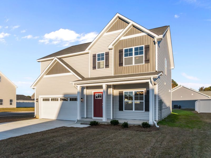 Front exterior of a new home in Arbor Hills South, Greenville, NC, highlighting curb appeal (Image 2). Front exterior of a new home in Arbor Hills South, Greenville, NC, highlighting curb appeal (Image 2).