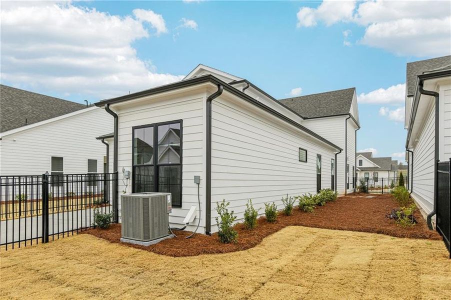 Exterior details and patio area of a home in Promenade at Sawnee Village, Cumming (Image 28).