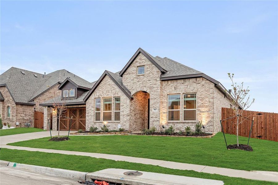 Front exterior of a new home in The Oaks, Red Oak, TX, highlighting curb appeal (Image 20).