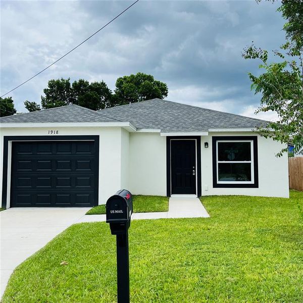 Front exterior of a new home in , Haines City, FL, highlighting curb appeal (Image 5). Front exterior of a new home in , Haines City, FL, highlighting curb appeal (Image 5).