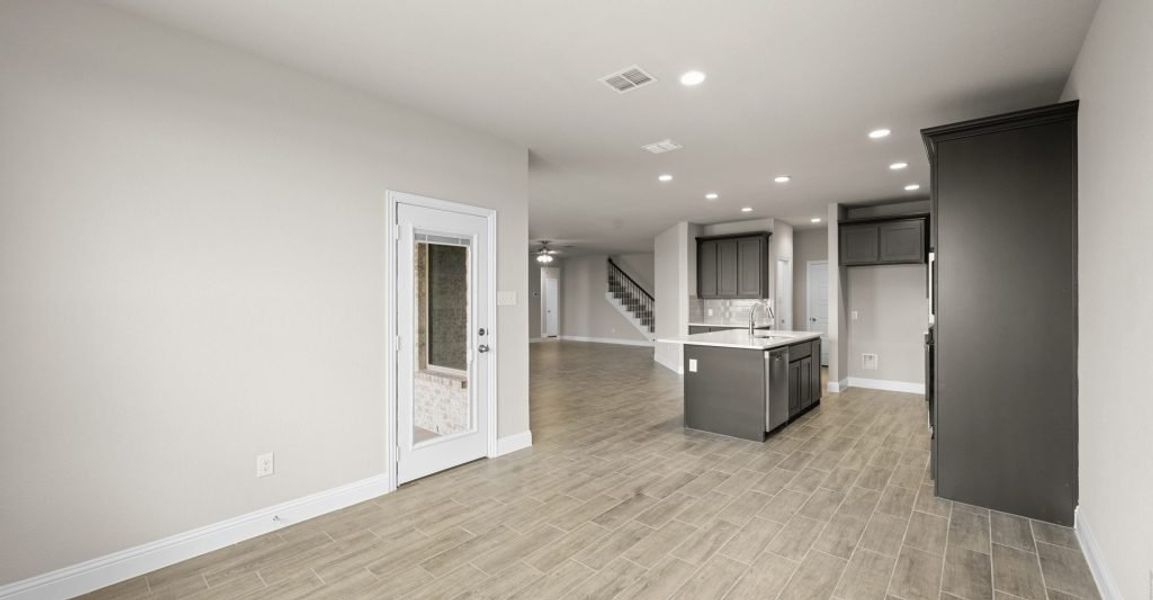 Representative exterior photo of a completed home built from the Donnington by Impression Homes in Still Water Lake, Godley, TX (Image 9).