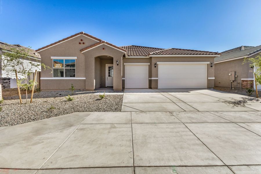 Front exterior of a new home in Landmarke, San Tan Valley, AZ, highlighting curb appeal (Image 1). Front exterior of a new home in Landmarke, San Tan Valley, AZ, highlighting curb appeal (Image 1).